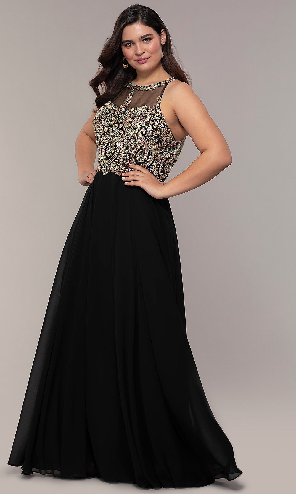 A woman poses with hands on hips in the Long Chiffon Embroidered-Bodice Prom Dress, featuring a sleeveless black design with a beaded embroidered bodice and flowing skirt, set against a plain background.